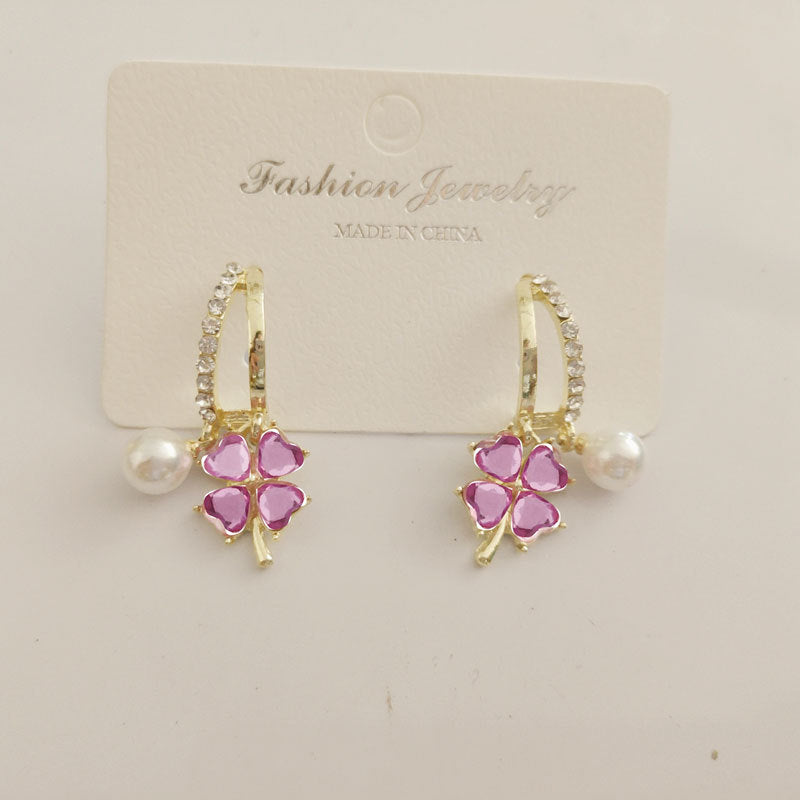Boucles d'oreilles en cristal violet avec fleur à quatre feuilles